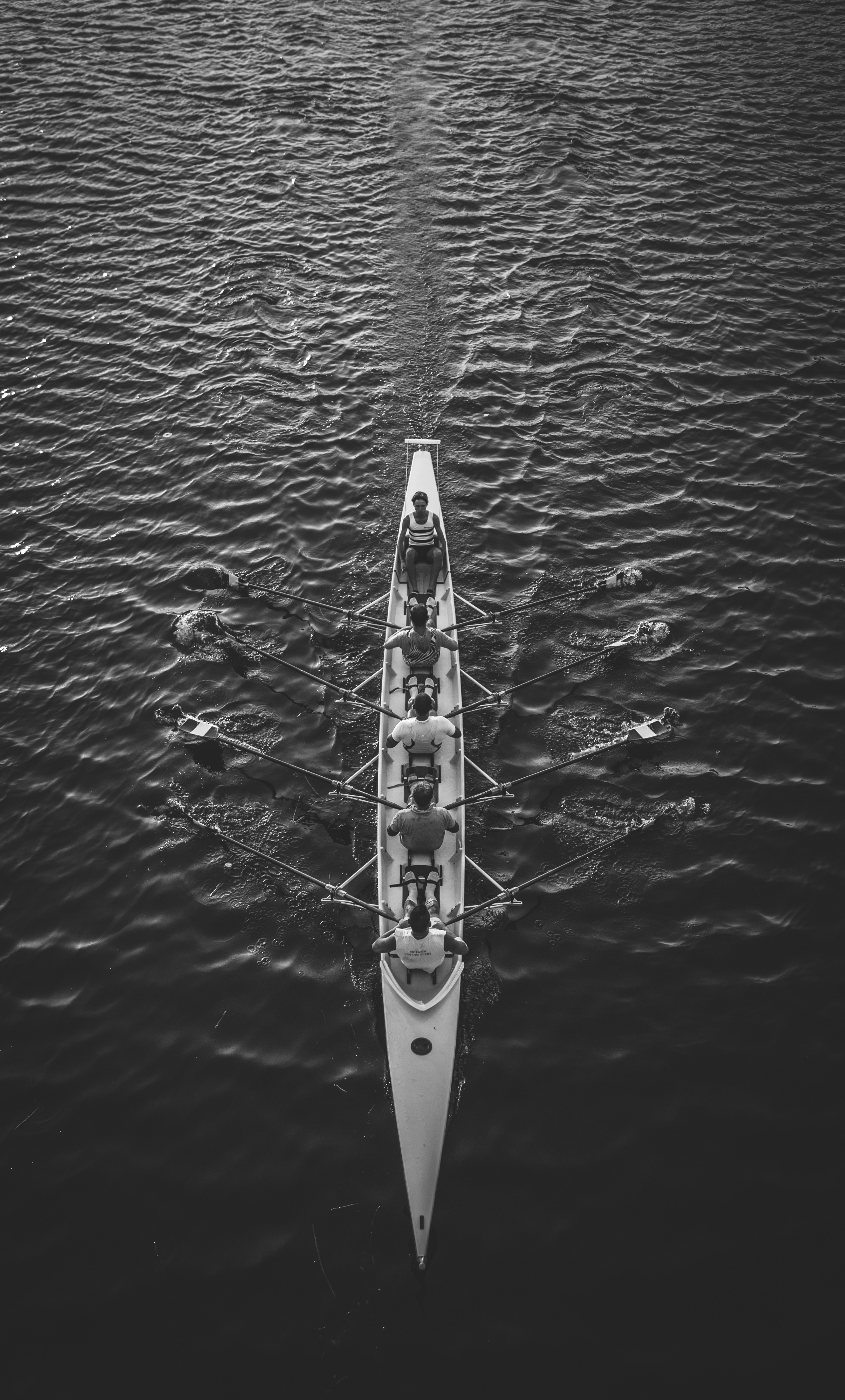 People riding a boat on a body of water